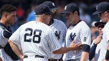 Aug 14, 2016; Bronx, NY, USA; New York Yankees relief pitcher Luis Cessa (85) is pulled from the game by manager Joe Girardi (28) during the seventh inning against the Tampa Bay Rays at Yankee Stadium. Mandatory Credit: Bill Streicher-USA TODAY Sports