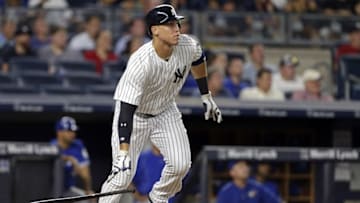 Aug 15, 2016; Bronx, NY, USA; New York Yankees right fielder Aaron Judge (99) hits an RBI double during the fourth inning against the Toronto Blue Jays at Yankee Stadium. Mandatory Credit: Adam Hunger-USA TODAY Sports