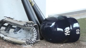 Mar 2, 2015; Tampa, FL, USA; New York Yankees center fielder Jake Cave (93) hat glove and ball rests near the clubhouse during spring training workouts at George M. Steinbrenner Field. Mandatory Credit: Reinhold Matay-USA TODAY Sports