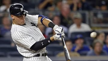 Aug 15, 2016; Bronx, NY, USA; New York Yankees right fielder Aaron Judge (99) hits an RBI double during the fourth inning against the Toronto Blue Jays at Yankee Stadium. Mandatory Credit: Adam Hunger-USA TODAY Sports