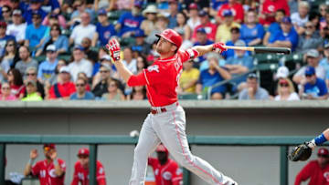 Mar 5, 2016; Mesa, AZ, USA; Cincinnati Reds center fielder Jake Cave (30) singles in the first inning against the Chicago Cubs at Sloan Park. Mandatory Credit: Matt Kartozian-USA TODAY Sports