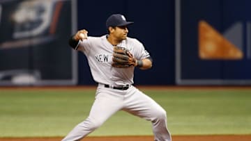 Sep 21, 2016; St. Petersburg, FL, USA; New York Yankees second baseman Donovan Solano (57) throws the ball to first base against the Tampa Bay Rays at Tropicana Field. Mandatory Credit: Kim Klement-USA TODAY Sports