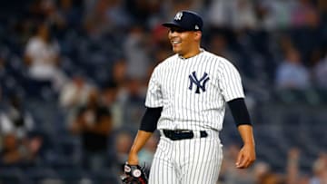 NEW YORK, NY - SEPTEMBER 19: Justus Sheffield #61 of the New York Yankees in his MLB debut celebrates after getting Mookie Betts #50 of the Boston Red Sox to ground into a double play to end the game in the ninth inning at Yankee Stadium on September 19, 2018 in the Bronx borough of New York City. New York Yankees defeated the Boston Red Sox 10-1. (Photo by Mike Stobe/Getty Images)