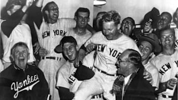CLEVELAND, OH - SEPTEMBER, 1955. Casey Stengel is shouting far left, Whitey Ford is bein hoisted on some shoulders in the New York Yankees celebration of the clinching of the pennant in their cliubhouse in Municipal Stadium in Cleveland, Ohio in September of 1955. (Photo by Mark Rucker/Transcendental Graphics, Getty Images)