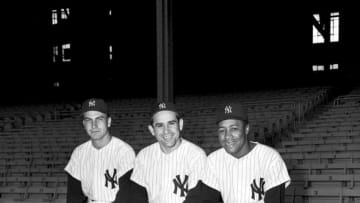 BRONX, NY - 1957: (l to r) Catchers, Darrell Johnson #39, Yogi Berra #8 and Elston Howard #32, of the New York Yankees, pose for the camera at Yankee Stadium in New York in 1957. (Olen Collection/Diamond Images/Getty Images)