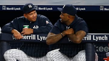 NEW YORK, NY - AUGUST 04: Alex Rodriguez #13 and CC Sabathia #52 of the New York Yankees watch the action from the dugout against the New York Mets a game at Yankee Stadium on August 4, 2016 in the Bronx borough of New York City. (Photo by Rich Schultz/Getty Images)