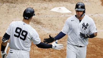 NEW YORK, NEW YORK - SEPTEMBER 26: (NEW YORK DAILIES OUT) Gary Sanchez #24 and Aaron Judge #99 of the New York Yankees in action against the Miami Marlins at Yankee Stadium on September 26, 2020 in New York City. The Yankees defeated the Marlins 11-4. (Photo by Jim McIsaac/Getty Images)