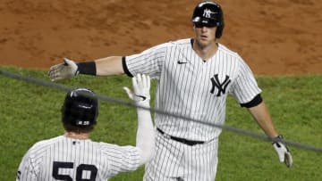 NEW YORK, NEW YORK - SEPTEMBER 17: (NEW YORK DAILIES OUT) DJ LeMahieu #26 of the New York Yankees celebrates his fourth inning home run against the Toronto Blue Jays with teammate Luke Voit #59 at Yankee Stadium on September 17, 2020 in New York City. The Yankees defeated the Blue Jays 10-7. (Photo by Jim McIsaac/Getty Images)