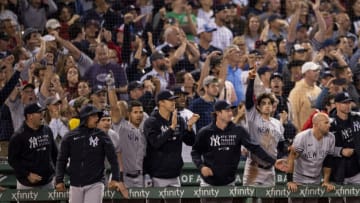 BOSTON, MA - SEPTEMBER 26: Members of the New York Yankees react after a go ahead RBI double during the eighth inning of a game against the Boston Red Sox on September 26, 2021 at Fenway Park in Boston, Massachusetts. (Photo by Billie Weiss/Boston Red Sox/Getty Images)
