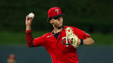 MINNEAPOLIS, MINNESOTA - AUGUST 31: Andrelton Simmons #9 of the Minnesota Twins throws the ball to first base to get out Frank Schwindel of the Chicago Cubs in the third inning of the game at Target Field on August 31, 2021 in Minneapolis, Minnesota. The Cubs defeated the Twins 3-1. (Photo by David Berding/Getty Images)