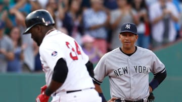 BOSTON, MA - AUGUST 17: Alex Rodriguez #13 of the New York Yankees watches as David Ortiz #34 of the Boston Red Sox rounds the bases after hitting a home run in the 7th inning at Fenway Park on August 17, 2013 in Boston, Massachusetts. (Photo by Jim Rogash/Getty Images)