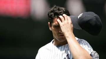 NEW YORK - JUNE 22: Carl Pavano #45 of the New York Yankees scratches his forehead against the Tampa Bay Devil Rays on June 22, 2005 at Yankee Stadium in the Bronx, New York. The Devil Rays won 5-3. (Photo by Al Bello/Getty Images)