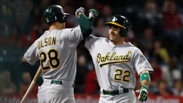 ANAHEIM, CALIFORNIA - SEPTEMBER 25: Matt Olson #28 congratulates Ramon Laureano #22 of the Oakland Athletics after his solo homerun during the fifth inning of a game against the Los Angeles Angels of Anaheimat Angel Stadium of Anaheim on September 25, 2019 in Anaheim, California. (Photo by Sean M. Haffey/Getty Images)