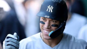 KANSAS CITY, MISSOURI - MAY 01: Aaron Judge #99 of the New York Yankees is congratulated by teammates in the dugout after hitting a solo home run during the 9th inning of the game against the Kansas City Royals at Kauffman Stadium on May 01, 2022 in Kansas City, Missouri. (Photo by Jamie Squire/Getty Images)