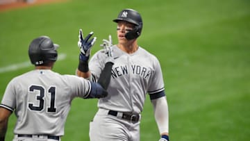 CLEVELAND, OHIO - SEPTEMBER 29: Aaron Hicks #31 celebrates with Aaron Judge #99 of the New York Yankees after Judge hit a two run homer during the first inning of Game One of the American League Wild Card Series against the Cleveland Indians at Progressive Field on September 29, 2020 in Cleveland, Ohio. (Photo by Jason Miller/Getty Images)
