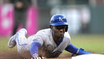 SAN FRANCISCO, CALIFORNIA - JUNE 14: Michael A. Taylor #2 of the Kansas City Royals dives into third base safe against the San Francisco Giants in the top of the six inning at Oracle Park on June 14, 2022 in San Francisco, California. (Photo by Thearon W. Henderson/Getty Images)
