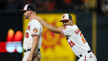 BALTIMORE, MD - JULY 07: Trey Mancini #16 and Anthony Santander #25 of the Baltimore Orioles react after the game against the Los Angeles Angels at Oriole Park at Camden Yards on July 7, 2022 in Baltimore, Maryland. (Photo by Scott Taetsch/Getty Images)