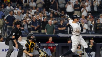 NEW YORK, NEW YORK - SEPTEMBER 20: Aaron Judge #99 of the New York Yankees hits his 60th home run of the season during the 9th inning of the game against the Pittsburgh Pirates at Yankee Stadium on September 20, 2022 in the Bronx borough of New York City. (Photo by Jamie Squire/Getty Images)