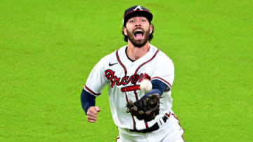 ATLANTA, GEORGIA - OCTOBER 12: Dansby Swanson #7 of the Atlanta Braves catches an out against the Philadelphia Phillies during the sixth inning in game two of the National League Division Series at Truist Park on October 12, 2022 in Atlanta, Georgia. (Photo by Adam Hagy/Getty Images)