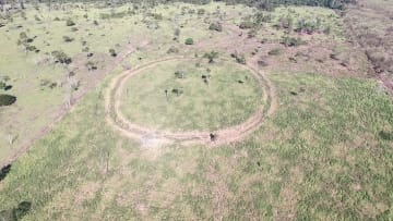 Aerial photo of site Mt05, a circular enclosure (140 meter diameter) located on a hilltop.