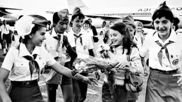 Samantha Smith (second from right) is greeted by Russian Young Pioneers at the airport in Moscow in 1983.