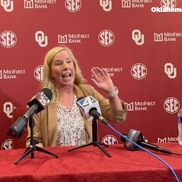 Oklahoma coach Patty Gasso speaks after her statue was unveiled at Love's Field.