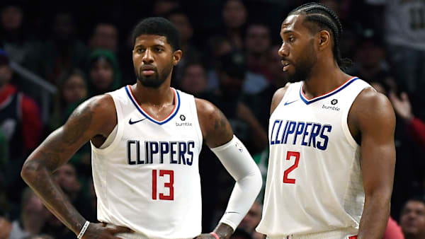 LOS ANGELES, CA - NOVEMBER 20: Paul George #13 Los Angeles Clippers and Kawhi Leonard #2 during overtime against Boston Celtics at Staples Center on November 20, 2019 in Los Angeles, California. It was the first time this season the pair played together after joining the Clippers. NOTE TO USER: User expressly acknowledges and agrees that, by downloading and/or using this Photograph, user is consenting to the terms and conditions of the Getty Images License Agreement. (Photo by Kevork Djansezian/Getty Images) LOS ANGELES, CA - NOVEMBER 20: Paul George #13 Los Angeles Clippers and Kawhi Leonard #2 during overtime against Boston Celtics at Staples Center on November 20, 2019 in Los Angeles, California. It was the first time this season the pair played together after joining the Clippers. NOTE TO USER: User expressly acknowledges and agrees that, by downloading and/or using this Photograph, user is consenting to the terms and conditions of the Getty Images License Agreement. (Photo by Kevork Djansezian/Getty Images)
