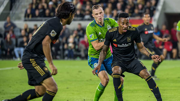 LOS ANGELES, CA - OCTOBER 29: Mark-Anthony Kaye #14 of Los Angeles FC passes to Carlos Vela #10 of Los Angeles FC during the MLS Western Conference Final between Los Angeles FC and Seattle Sounders at the Banc of California Stadium on October 29, 2019 in Los Angeles, California. Seattle Sounders won the match 3-1 (Photo by Shaun Clark/Getty Images) LOS ANGELES, CA - OCTOBER 29: Mark-Anthony Kaye #14 of Los Angeles FC passes to Carlos Vela #10 of Los Angeles FC during the MLS Western Conference Final between Los Angeles FC and Seattle Sounders at the Banc of California Stadium on October 29, 2019 in Los Angeles, California. Seattle Sounders won the match 3-1 (Photo by Shaun Clark/Getty Images)