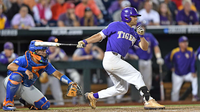 OMAHA, NE - JUNE 26: Third basemen Josh Smith #4 of the LSU Tigers hits an RBI single against the Florida Gators in the eighth inning during game one of the College World Series Championship Series on June 26, 2017 at TD Ameritrade Park in Omaha, Nebraska. (Photo by Peter Aiken/Getty Images) OMAHA, NE - JUNE 26: Third basemen Josh Smith #4 of the LSU Tigers hits an RBI single against the Florida Gators in the eighth inning during game one of the College World Series Championship Series on June 26, 2017 at TD Ameritrade Park in Omaha, Nebraska. (Photo by Peter Aiken/Getty Images)
