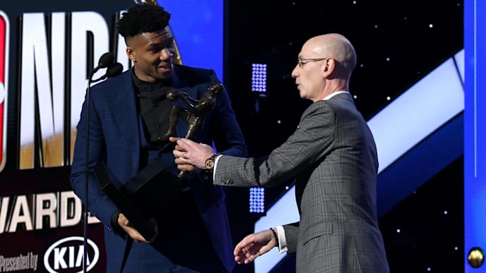 SANTA MONICA, CALIFORNIA - JUNE 24: (L-R) Giannis Antetokounmpo accepts the Kia NBA Most Valuable Player award from NBA Commissioner Adam Silver onstage during the 2019 NBA Awards presented by Kia on TNT at Barker Hangar on June 24, 2019 in Santa Monica, California. (Photo by Michael Kovac/Getty Images for Turner Sports) SANTA MONICA, CALIFORNIA - JUNE 24: (L-R) Giannis Antetokounmpo accepts the Kia NBA Most Valuable Player award from NBA Commissioner Adam Silver onstage during the 2019 NBA Awards presented by Kia on TNT at Barker Hangar on June 24, 2019 in Santa Monica, California. (Photo by Michael Kovac/Getty Images for Turner Sports)