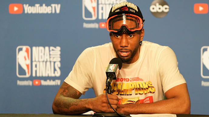 OAKLAND, CALIFORNIA - JUNE 13: Kawhi Leonard #2 of the Toronto Raptors speaks with the media following his teams victory over the Golden State Warriors to winGame Six of the 2019 NBA Finals at ORACLE Arena on June 13, 2019 in Oakland, California. NOTE TO USER: User expressly acknowledges and agrees that, by downloading and or using this photograph, User is consenting to the terms and conditions of the Getty Images License Agreement. (Photo by Thearon W. Henderson/Getty Images) OAKLAND, CALIFORNIA - JUNE 13: Kawhi Leonard #2 of the Toronto Raptors speaks with the media following his teams victory over the Golden State Warriors to winGame Six of the 2019 NBA Finals at ORACLE Arena on June 13, 2019 in Oakland, California. NOTE TO USER: User expressly acknowledges and agrees that, by downloading and or using this photograph, User is consenting to the terms and conditions of the Getty Images License Agreement. (Photo by Thearon W. Henderson/Getty Images)