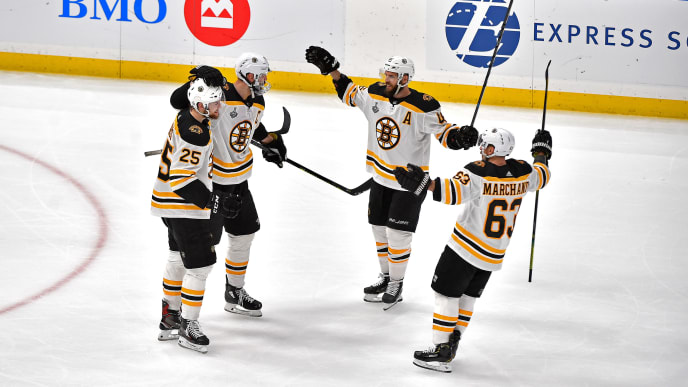 ST LOUIS, MISSOURI - JUNE 09: Zdeno Chara #33 of the Boston Bruins is congratulated by his teammates after scoring a third period empty-net goal against the St. Louis Blues in Game Six of the 2019 NHL Stanley Cup Final at Enterprise Center on June 09, 2019 in St Louis, Missouri. (Photo by Ed Zurga/Getty Images) ST LOUIS, MISSOURI - JUNE 09: Zdeno Chara #33 of the Boston Bruins is congratulated by his teammates after scoring a third period empty-net goal against the St. Louis Blues in Game Six of the 2019 NHL Stanley Cup Final at Enterprise Center on June 09, 2019 in St Louis, Missouri. (Photo by Ed Zurga/Getty Images)