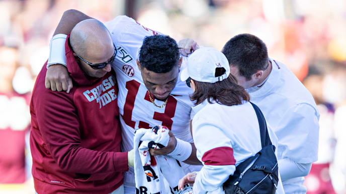 FAYETTEVILLE, AR - NOVEMBER 9: Tua Tagovailoa #13 of the Alabama Crimson Tide is helped off the field after being injured on a play in the first half of a game against the Mississippi State Bulldogs at Davis Wade Stadium on November 16, 2019 in Starkville, Mississippi. (Photo by Wesley Hitt/Getty Images) FAYETTEVILLE, AR - NOVEMBER 9: Tua Tagovailoa #13 of the Alabama Crimson Tide is helped off the field after being injured on a play in the first half of a game against the Mississippi State Bulldogs at Davis Wade Stadium on November 16, 2019 in Starkville, Mississippi. (Photo by Wesley Hitt/Getty Images)