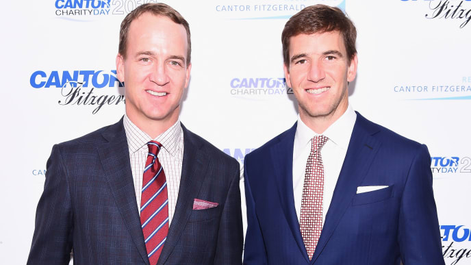 NEW YORK, NY - SEPTEMBER 12: Former NFL player Peyton Manning and NY Giants, NFL player Eli Manning attend the Annual Charity Day hosted by Cantor Fitzgerald, BGC and GFI at Cantor Fitzgerald on September 12, 2016 in New York City. (Photo by Dave Kotinsky/Getty Images for Cantor Fitzgerald) NEW YORK, NY - SEPTEMBER 12: Former NFL player Peyton Manning and NY Giants, NFL player Eli Manning attend the Annual Charity Day hosted by Cantor Fitzgerald, BGC and GFI at Cantor Fitzgerald on September 12, 2016 in New York City. (Photo by Dave Kotinsky/Getty Images for Cantor Fitzgerald)