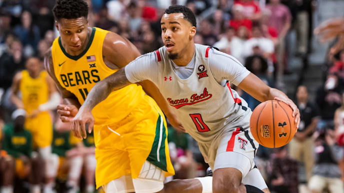 Texas Tech's Kyler Edwards dribbles past a defender against Baylor. Texas Tech's Kyler Edwards dribbles past a defender against Baylor.