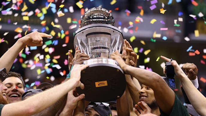 INDIANAPOLIS, IN - MARCH 16: The Michigan State Spartans hold the winner's trophy after the 69-55 win over the Michigan Wolverines during the finals of the Big Ten Basketball Tournament at Bankers Life Fieldhouse on March 16, 2014 in Indianapolis, Indiana. (Photo by Andy Lyons/Getty Images) INDIANAPOLIS, IN - MARCH 16: The Michigan State Spartans hold the winner's trophy after the 69-55 win over the Michigan Wolverines during the finals of the Big Ten Basketball Tournament at Bankers Life Fieldhouse on March 16, 2014 in Indianapolis, Indiana. (Photo by Andy Lyons/Getty Images)