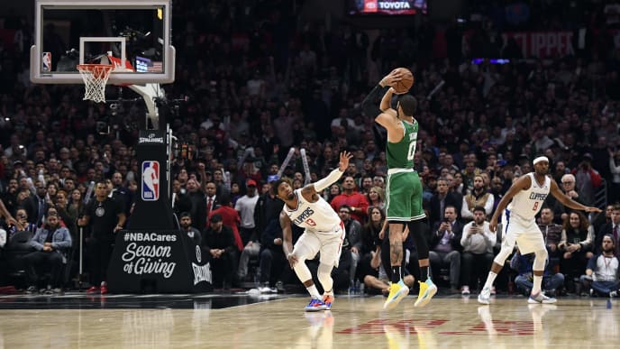 LOS ANGELES, CA - NOVEMBER 20: Jayson Tatum #0 of the Boston Celtics ties the game with a three-point basket in regulation to force overtime against Paul George #13 of the Los Angeles Clippers at Staples Center on November 20, 2019 in Los Angeles, California. NOTE TO USER: User expressly acknowledges and agrees that, by downloading and/or using this Photograph, user is consenting to the terms and conditions of the Getty Images License Agreement. (Photo by Kevork Djansezian/Getty Images) LOS ANGELES, CA - NOVEMBER 20: Jayson Tatum #0 of the Boston Celtics ties the game with a three-point basket in regulation to force overtime against Paul George #13 of the Los Angeles Clippers at Staples Center on November 20, 2019 in Los Angeles, California. NOTE TO USER: User expressly acknowledges and agrees that, by downloading and/or using this Photograph, user is consenting to the terms and conditions of the Getty Images License Agreement. (Photo by Kevork Djansezian/Getty Images)