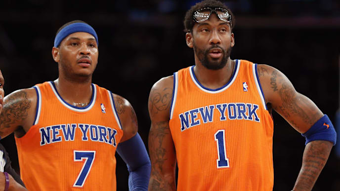 NEW YORK, NY - DECEMBER 08: Carmelo Anthony #7 and Amar'e Stoudemire #1 of the New York Knicks wait for play to resume during the second quarter against the Boston Celtics at Madison Square Garden on December 8, 2013 in New York City. NOTE TO USER: User expressly acknowledges and agrees that, by downloading and or using this Photograph, user is consenting to the terms and conditions of the Getty Images License Agreement. (Photo by Bruce Bennett/Getty Images) NEW YORK, NY - DECEMBER 08: Carmelo Anthony #7 and Amar'e Stoudemire #1 of the New York Knicks wait for play to resume during the second quarter against the Boston Celtics at Madison Square Garden on December 8, 2013 in New York City. NOTE TO USER: User expressly acknowledges and agrees that, by downloading and or using this Photograph, user is consenting to the terms and conditions of the Getty Images License Agreement. (Photo by Bruce Bennett/Getty Images)