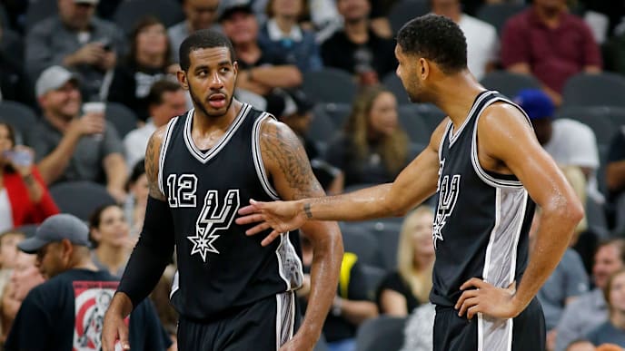 SAN ANTONIO, TX - OCTOBER 30: LaMarcus Aldridge #12 and Tim Duncan #21 of the San Antonio Spurs talk during the game with the Brooklyn Nets at the AT&T Center on October 30, 2015 in San Antonio, Texas. NOTE TO USER: User expressly acknowledges and agrees that, by downloading to the terms and conditions of the Getty Images License Agreement. (Photo by Chris Covatta/Getty Images) SAN ANTONIO, TX - OCTOBER 30: LaMarcus Aldridge #12 and Tim Duncan #21 of the San Antonio Spurs talk during the game with the Brooklyn Nets at the AT&T Center on October 30, 2015 in San Antonio, Texas. NOTE TO USER: User expressly acknowledges and agrees that, by downloading to the terms and conditions of the Getty Images License Agreement. (Photo by Chris Covatta/Getty Images)