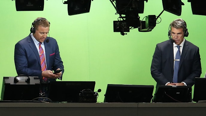 ATLANTA, GA - JANUARY 08: ESPN television personalities Kirk Herbstreit (left) and Chris Fowler prepare for the College Football Playoff National Championship game between the Georgia Bulldogs and the Alabama Crimson Tide at Mercedes-Benz Stadium on January 8, 2018 in Atlanta, Georgia. (Photo by Mike Zarrilli/Getty Images) ATLANTA, GA - JANUARY 08: ESPN television personalities Kirk Herbstreit (left) and Chris Fowler prepare for the College Football Playoff National Championship game between the Georgia Bulldogs and the Alabama Crimson Tide at Mercedes-Benz Stadium on January 8, 2018 in Atlanta, Georgia. (Photo by Mike Zarrilli/Getty Images)