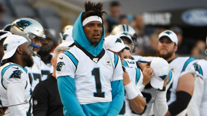 CHICAGO, ILLINOIS - AUGUST 08: Cam Newton #1 of the Carolina Panthers stands on the sidelines in the first half during a preseason game against the Chicago Bears at Soldier Field on August 08, 2019 in Chicago, Illinois. (Photo by David Banks/Getty Images) CHICAGO, ILLINOIS - AUGUST 08: Cam Newton #1 of the Carolina Panthers stands on the sidelines in the first half during a preseason game against the Chicago Bears at Soldier Field on August 08, 2019 in Chicago, Illinois. (Photo by David Banks/Getty Images)