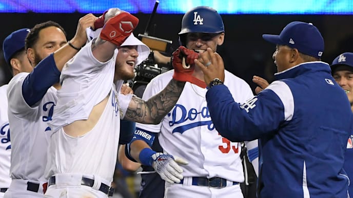 LOS ANGELES, CA - JUNE 22: Alex Verdugo #27 of the Los Angeles Dodgers celebrates with team mates who tore off his jersey after his 11th inning walk-off home run defeated the Colorado Rockies 5-4 at Dodger Stadium on June 22, 2019 in Los Angeles, California. (Photo by John McCoy/Getty Images) LOS ANGELES, CA - JUNE 22: Alex Verdugo #27 of the Los Angeles Dodgers celebrates with team mates who tore off his jersey after his 11th inning walk-off home run defeated the Colorado Rockies 5-4 at Dodger Stadium on June 22, 2019 in Los Angeles, California. (Photo by John McCoy/Getty Images)