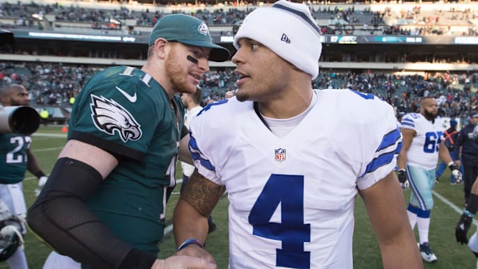 PHILADELPHIA, PA - JANUARY 1: Carson Wentz #11 of the Philadelphia Eagles hugs Dak Prescott #4 of the Dallas Cowboys after the game at Lincoln Financial Field on January 1, 2017 in Philadelphia, Pennsylvania. The Eagles defeated the Cowboys 27-13. (Photo by Mitchell Leff/Getty Images) PHILADELPHIA, PA - JANUARY 1: Carson Wentz #11 of the Philadelphia Eagles hugs Dak Prescott #4 of the Dallas Cowboys after the game at Lincoln Financial Field on January 1, 2017 in Philadelphia, Pennsylvania. The Eagles defeated the Cowboys 27-13. (Photo by Mitchell Leff/Getty Images)