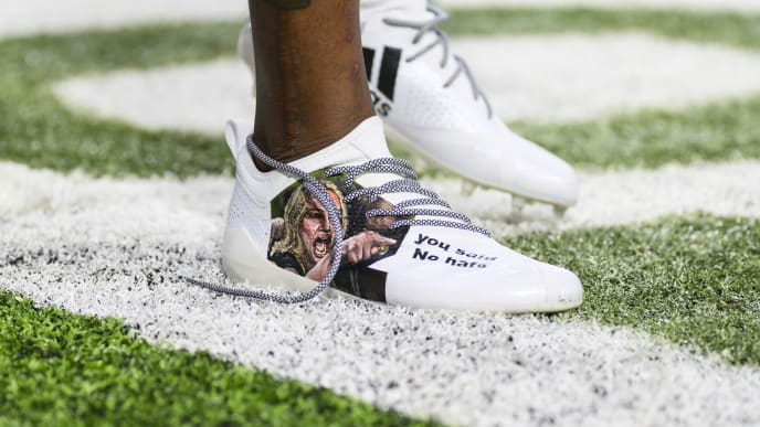 MINNEAPOLIS, MN - NOVEMBER 17: Stefon Diggs #14 of the Minnesota Vikings wears custom shoes before the game against the Denver Broncos at U.S. Bank Stadium on November 17, 2019 in Minneapolis, Minnesota. (Photo by Stephen Maturen/Getty Images) MINNEAPOLIS, MN - NOVEMBER 17: Stefon Diggs #14 of the Minnesota Vikings wears custom shoes before the game against the Denver Broncos at U.S. Bank Stadium on November 17, 2019 in Minneapolis, Minnesota. (Photo by Stephen Maturen/Getty Images)