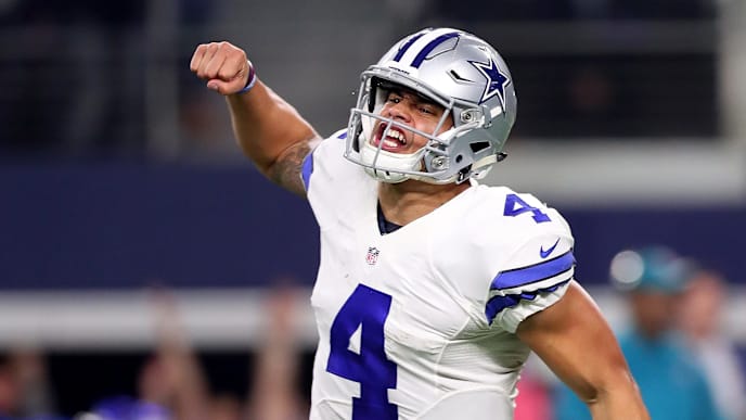 ARLINGTON, TX - JANUARY 15: Dak Prescott #4 of the Dallas Cowboys celebrates after throwing a touchdown pass during the fourth quarter against the Green Bay Packers in the NFC Divisional Playoff game at AT&T Stadium on January 15, 2017 in Arlington, Texas. (Photo by Tom Pennington/Getty Images) ARLINGTON, TX - JANUARY 15: Dak Prescott #4 of the Dallas Cowboys celebrates after throwing a touchdown pass during the fourth quarter against the Green Bay Packers in the NFC Divisional Playoff game at AT&T Stadium on January 15, 2017 in Arlington, Texas. (Photo by Tom Pennington/Getty Images)