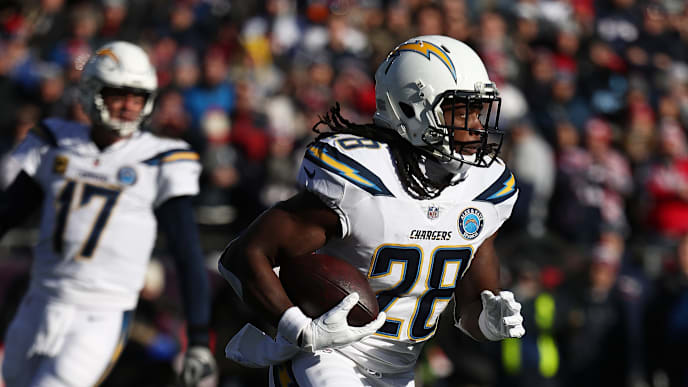 FOXBOROUGH, MASSACHUSETTS - JANUARY 13: Melvin Gordon #28 of the Los Angeles Chargers in action against the New England Patriots during their AFC Divisional Round playoff game at Gillette Stadium on January 13, 2019 in Foxborough, Massachusetts. (Photo by Al Bello/Getty Images) FOXBOROUGH, MASSACHUSETTS - JANUARY 13: Melvin Gordon #28 of the Los Angeles Chargers in action against the New England Patriots during their AFC Divisional Round playoff game at Gillette Stadium on January 13, 2019 in Foxborough, Massachusetts. (Photo by Al Bello/Getty Images)