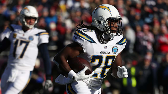FOXBOROUGH, MASSACHUSETTS - JANUARY 13: Melvin Gordon #28 of the Los Angeles Chargers in action against the New England Patriots during their AFC Divisional Round playoff game at Gillette Stadium on January 13, 2019 in Foxborough, Massachusetts. (Photo by Al Bello/Getty Images) FOXBOROUGH, MASSACHUSETTS - JANUARY 13: Melvin Gordon #28 of the Los Angeles Chargers in action against the New England Patriots during their AFC Divisional Round playoff game at Gillette Stadium on January 13, 2019 in Foxborough, Massachusetts. (Photo by Al Bello/Getty Images)