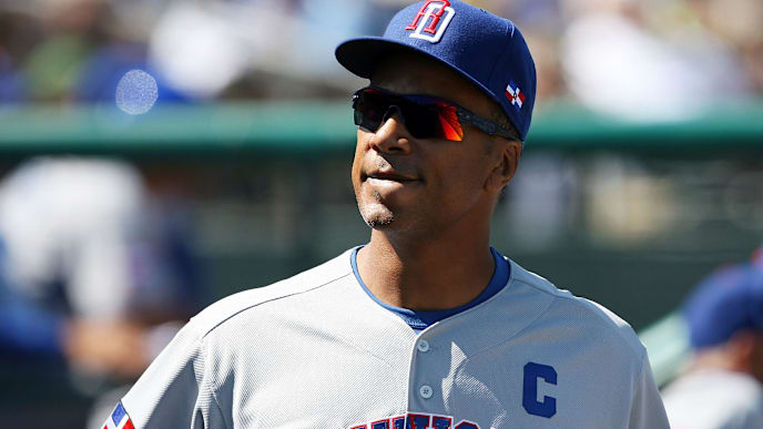 JUPITER, FL - MARCH 3: Moises Alou #18 of the Dominican Republic smiles in the dugout while taking on the Florida Marlins during an exhibition game at Roger Dean Stadium March 3, 2009 in Jupiter, Florida. (Photo by Doug Benc/Getty Images) JUPITER, FL - MARCH 3: Moises Alou #18 of the Dominican Republic smiles in the dugout while taking on the Florida Marlins during an exhibition game at Roger Dean Stadium March 3, 2009 in Jupiter, Florida. (Photo by Doug Benc/Getty Images)