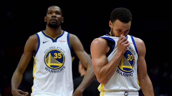 LOS ANGELES, CALIFORNIA - APRIL 26: Stephen Curry #30 and Kevin Durant #35 of the Golden State Warriors leave the court with a lead late in the fourth quarter in a 129-110 win over the LA Clippers during Game Six of Round One of the 2019 NBA Playoffs at Staples Center on April 26, 2019 in Los Angeles, California. (Photo by Harry How/Getty Images) NOTE TO USER: User expressly acknowledges and agrees that, by downloading and or using this photograph, User is consenting to the terms and conditions of the Getty Images License Agreement. LOS ANGELES, CALIFORNIA - APRIL 26: Stephen Curry #30 and Kevin Durant #35 of the Golden State Warriors leave the court with a lead late in the fourth quarter in a 129-110 win over the LA Clippers during Game Six of Round One of the 2019 NBA Playoffs at Staples Center on April 26, 2019 in Los Angeles, California. (Photo by Harry How/Getty Images) NOTE TO USER: User expressly acknowledges and agrees that, by downloading and or using this photograph, User is consenting to the terms and conditions of the Getty Images License Agreement.