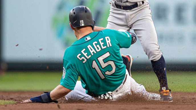 SEATTLE, WA - JUNE 5: Second baseman Tony Kemp #18 of the Houston Astros turns a double play after forcing out Kyle Seager #15 of the Seattle Mariners at second base on a ball hit by Domingo Santana #16 of the Seattle Mariners during the second inning of a game at T-Mobile Park on June 5, 2019 in Seattle, Washington. (Photo by Stephen Brashear/Getty Images) SEATTLE, WA - JUNE 5: Second baseman Tony Kemp #18 of the Houston Astros turns a double play after forcing out Kyle Seager #15 of the Seattle Mariners at second base on a ball hit by Domingo Santana #16 of the Seattle Mariners during the second inning of a game at T-Mobile Park on June 5, 2019 in Seattle, Washington. (Photo by Stephen Brashear/Getty Images)